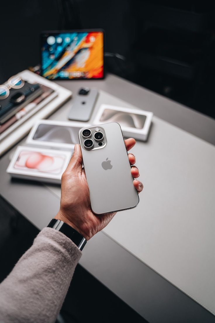 Hand holding refurbished smartphone